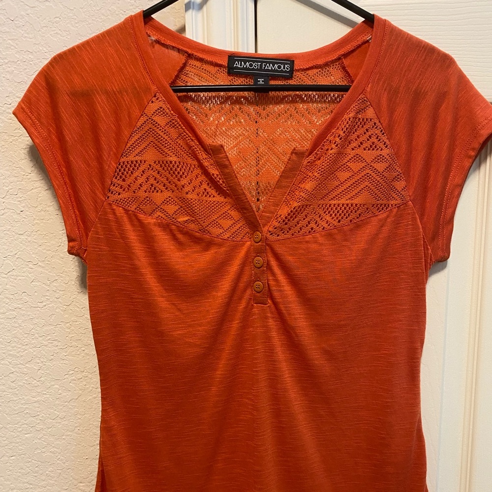 Short sleeve burnt orange shirt with cut out detail